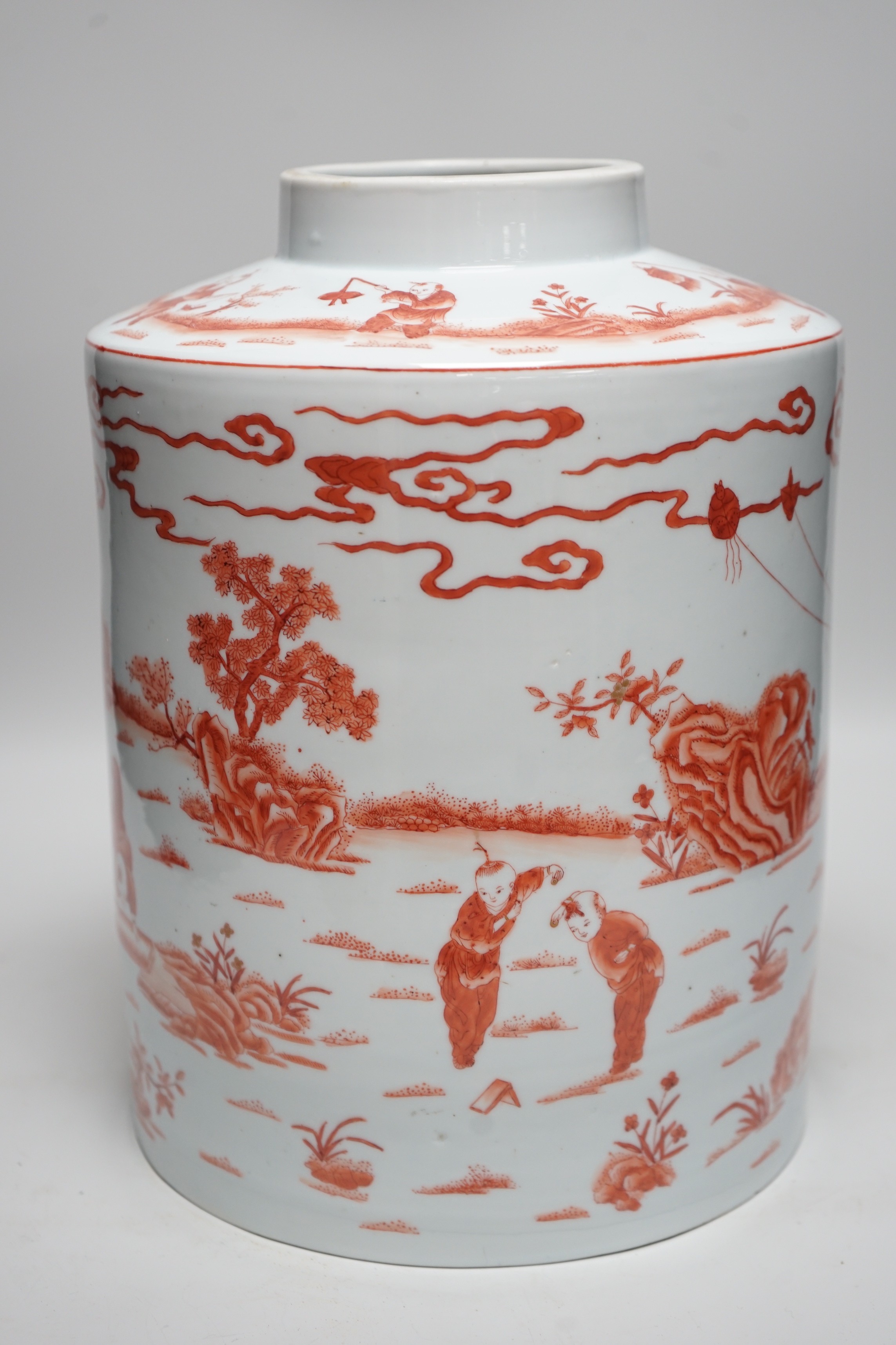 An early 20th century copper red enamelled canister. 30cm tall